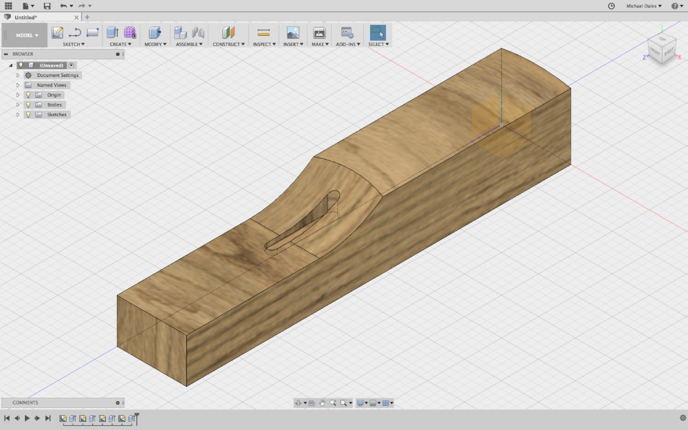 A screenshot of a CAD model showing a small block of wood with the headstock to fretboard transition of a neck modelled into it.